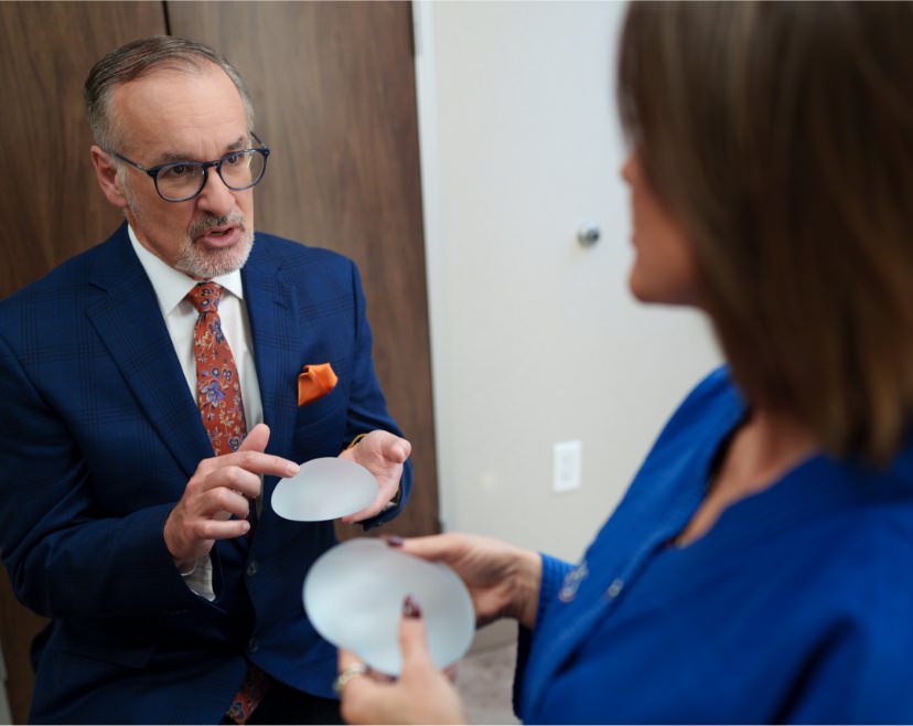 Dr. Paul Fortes holding breast implant