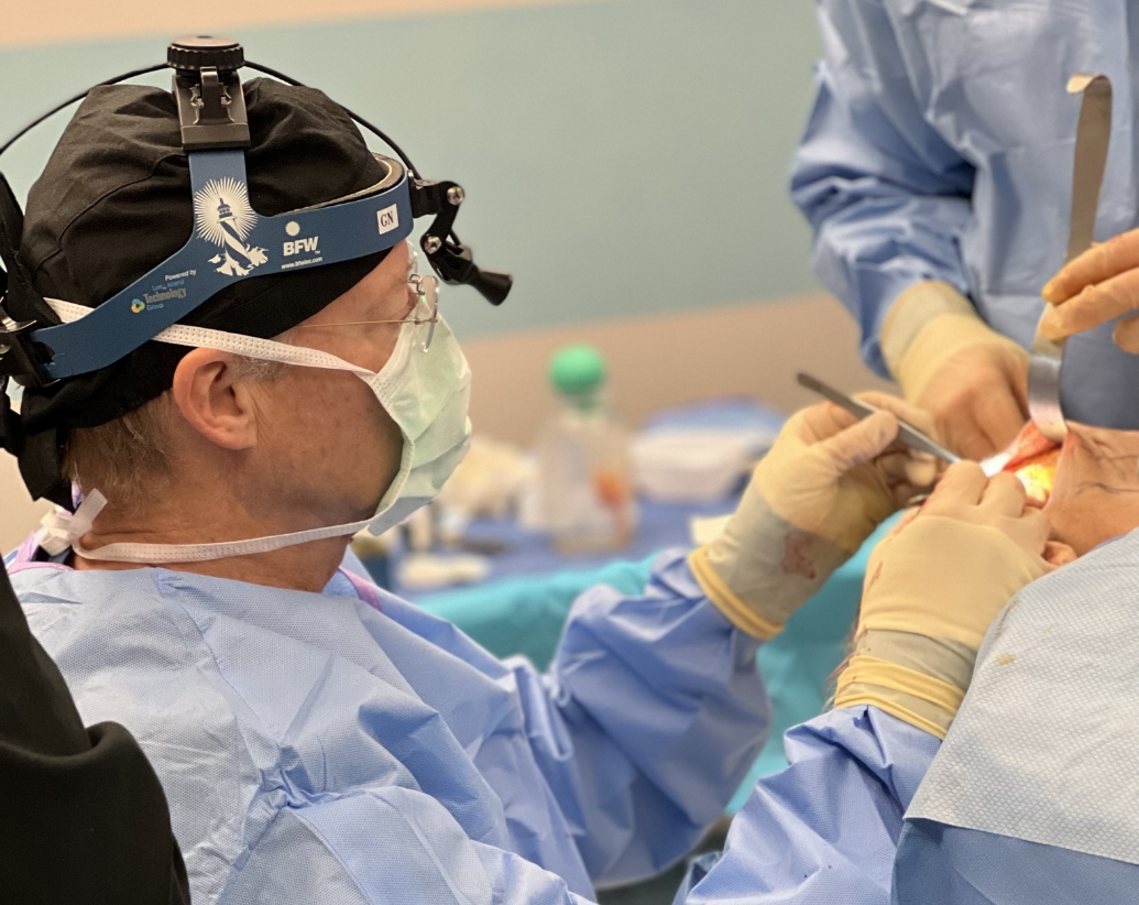 Dr. Henry Mentz in operating room preforming surgery