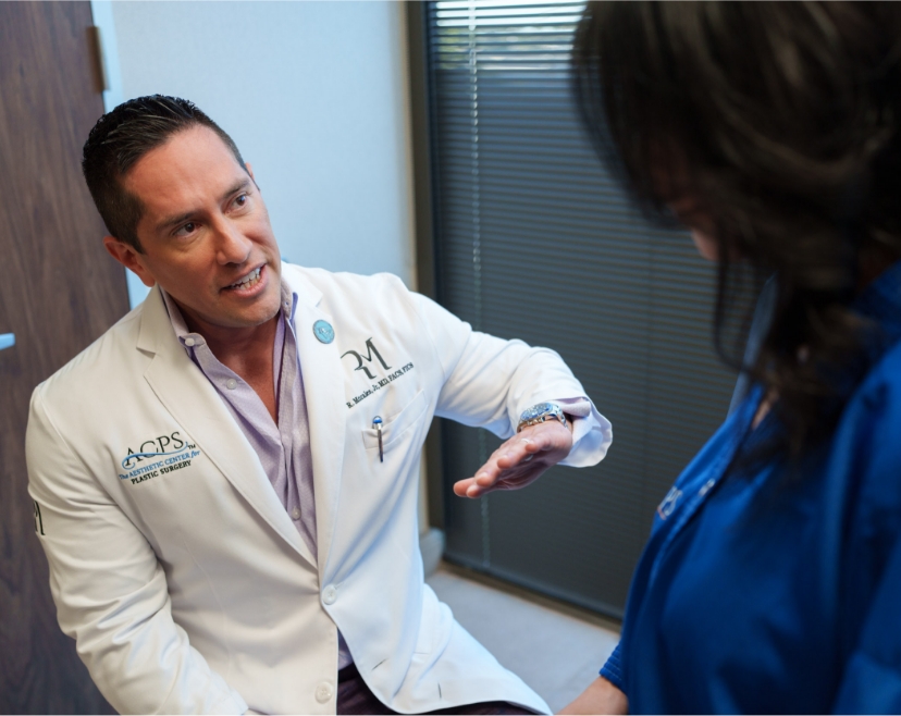 Dr. Rolando Morales with patient