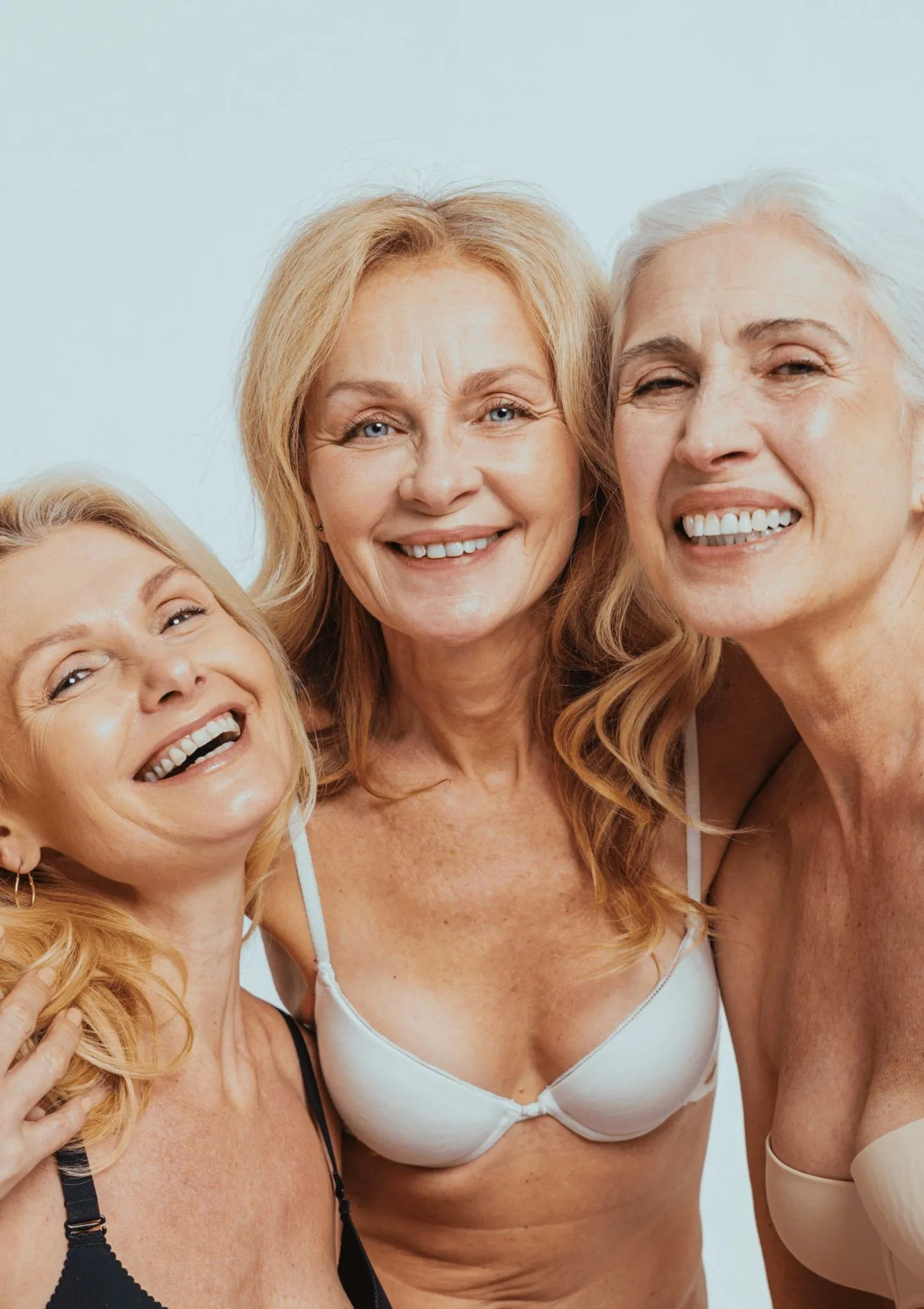 Three elder women smiling