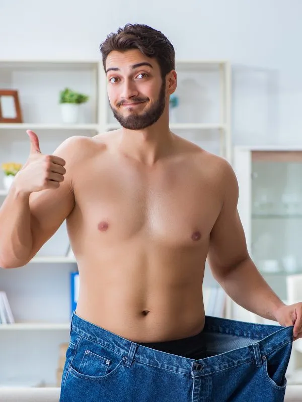 Man wearing old pants from weight loss