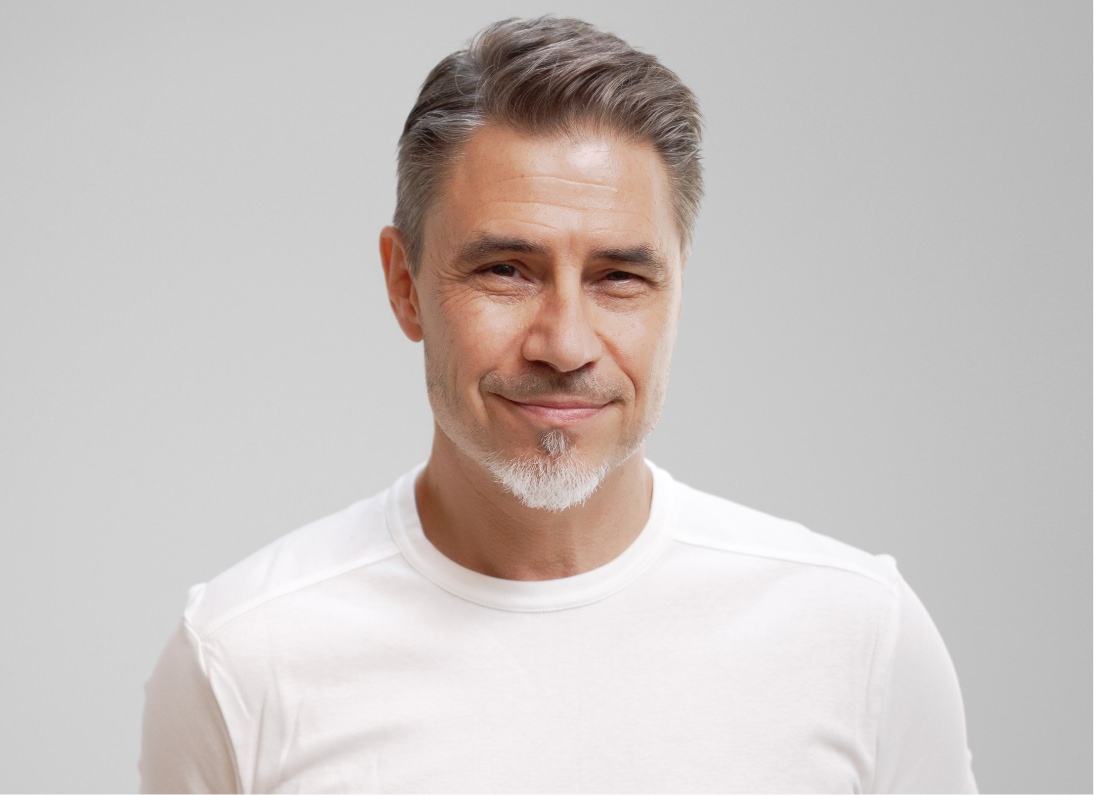 elder gentleman wearing a white shirt
