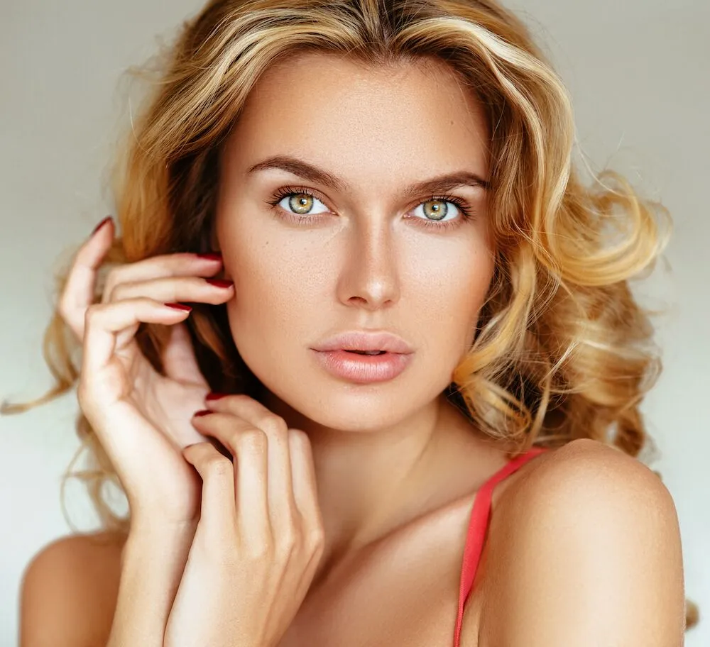 Woman touching face