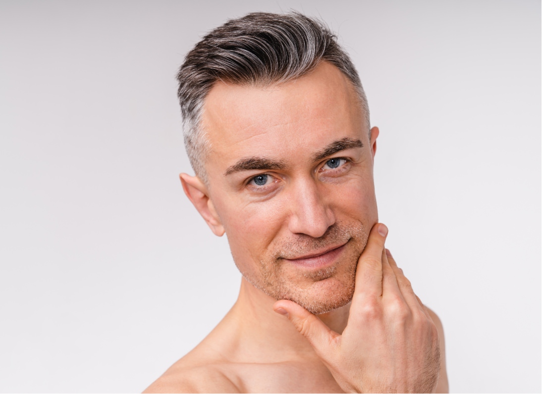 middle aged man with fingers placed on chin