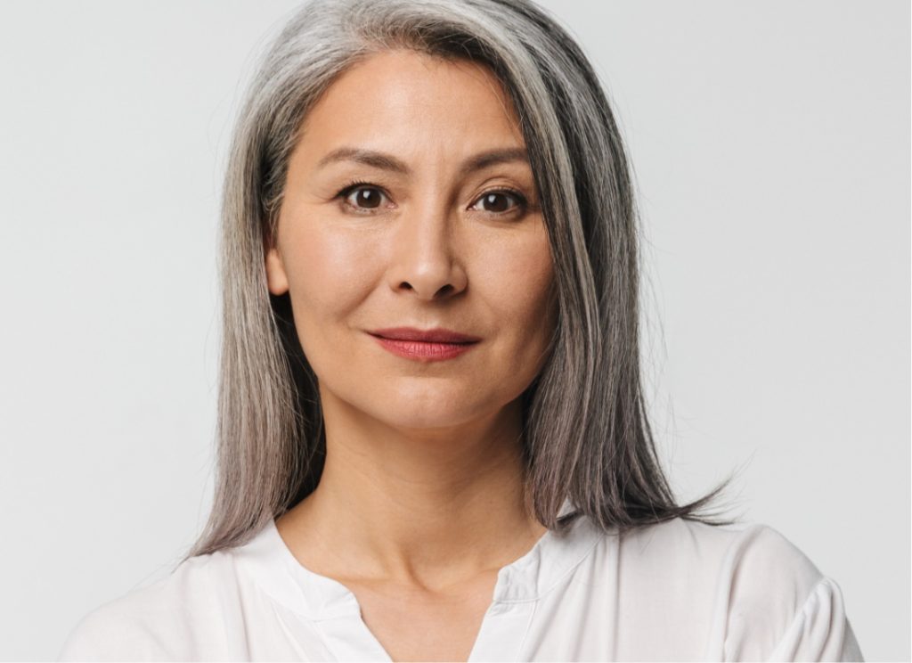 Model with gray hair looking forward
