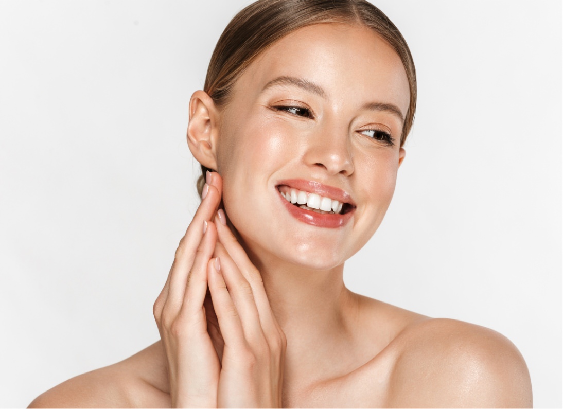 Model smiling with glowing skin