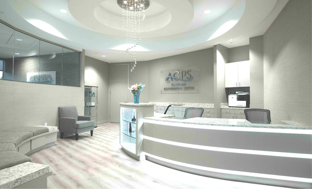 ACPS Med Spa front desk and reception area featuring modern design, comfortable seating, and contemporary lighting.